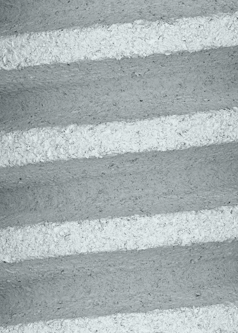 Detail magnification of threaded orthopedic screw showing rough surface texture after post-processing with micro abrasive
