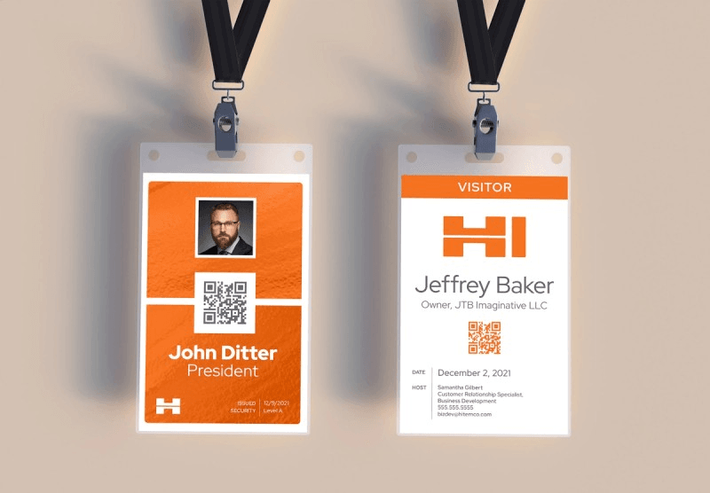 Branded employee and visitor badge designs on lanyards hanging side by side